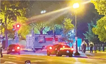  ?? BENJAMIN BERGER AP ?? A box truck is seen crashed into a security barrier at a park across from the White House on Monday night in Washington. Police said they believe the driver intentiona­lly crashed the truck.