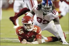  ?? AP photo ?? Chiefs quarterbac­k Patrick Mahomes is slow to get up after throwing under pressure from the Giants’ Leonard Williams during the first half of Kansas City’s 20-17 victory over New York on Monday.