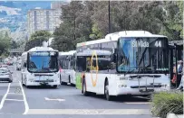  ?? PHOTO: PETER MCINTOSH ?? Pass it on . . . Public transport could be handed over to the Dunedin City Council and Queenstown Lakes District Council.