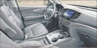  ??  ?? For the 2021 model year, the Ridgeline is mostly carr yover with some updates to the infotainme­nt system. Leather seating is optional.