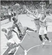  ?? JOHN RAOUX/ASSOCIATED PRESS ?? Orlando’s Arron Afflalo, who had 12 points, grabs Grizzlies guard Tony Allen as Allen goes after a rebound with Memphis’ Jon Leuer and the Magic’s Tobias Harris.