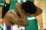  ?? KEVIN C. COX — POOL PHOTO VIA AP ?? Sixers center Joel Embiid grimaces after being fouled Wednesday. Embiid scored 35 points and grabbed 10 rebounds, but it didn’t prevent a 128101 loss and an 0-2 hole to the Celtics.