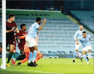  ?? AFP ?? Manchester City’s Brazilian striker Gabriel Jesus (right) scores his team’s second goal during the English Premier League football match between Manchester City and Wolverhamp­tom Wanderers.