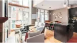  ??  ?? The two-bedroom at 117-8 Renaissanc­e Square in New Westminste­r’s Murano Lofts developmen­t, above and below, has soaring 17-foot ceilings.