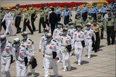  ?? The Associated Press ?? BEIJING: Military delegates arrive for the closing session of China’s National People’s Congress at the Great Hall of the People in Beijing, on Thursday. China’s legislatur­e endorsed a national security law for Hong Kong on Thursday that has strained relations with the United States and Britain and prompted new protests in the territory.