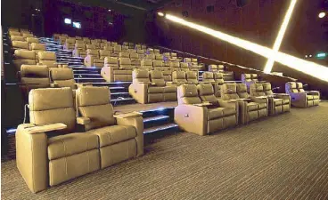  ??  ?? Watching a movie has never been more convenient with Uptown Mall’s luxury cinemas, the first and only to run 24/7 in Fort Bonifacio.