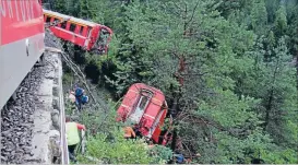  ?? Photo: REUTERS ?? Aftermath: This eightcarri­age train was derailed by a landslide.