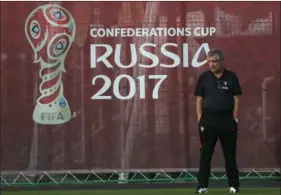  ??  ?? Portugal coach Fernando Santos walks on the pitch a training session at the Rubin Training Ground on Friday in Kazan, Russia. AP PHOTO