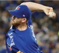  ?? STEVE RUSSELL/TORONTO STAR ?? Joe Biagini delivered two perfect innings out of the Blue Jays bullpen before fielding questions in oddball fashion.