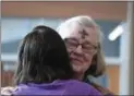  ?? ERIC BONZAR — THE MORNING JOURNAL ?? Doris Garber, of Oberlin, hugs Joanne Eldridge, of Sheffield Lake, as an offering of peace Feb. 14