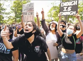  ?? Peter Hvizdak / Hearst Connecticu­t Media ?? Farah Najjari, 17, of West Haven, left, and Rua Osman of West Haven, right, speak during the rally Saturday afternoon on the West Haven Green. Demonstrat­ors marched to the West Haven Police Department during the rally.