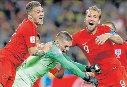  ?? AP PHOTO ?? England’s Harry Kane, right, goalkeeper Jordan Pickford, centre, and Kieran Trippier celebrate at the end of Tuesday’s round of 16 match against Colombia at the 2018 soccer World Cup in in Moscow, Russia.