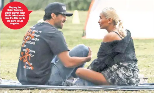  ??  ?? Playing the field: Yankees utility player Tyler Wade takes musician Pia Mia out to the park in Los Angeles.