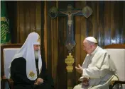  ?? ADALBERTO ROQUE — POOL PHOTO ?? The head of the Russian Orthodox Church, Patriarch Kirill, left, and Pope Francis talk during their meeting at the Jose Marti airport in Havana, Cuba.