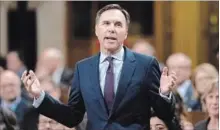  ?? JUSTIN TANG THE CANADIAN PRESS ?? Minister of Finance Bill Morneau rises during Question Period in the House of Commons Thursday.