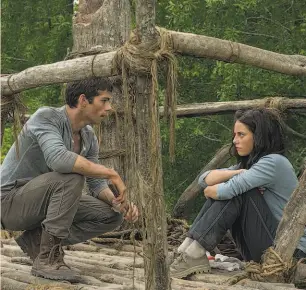  ?? 20th Century Fox ?? Dylan O’Brien and Kaya Scodelario in “The Maze Runner,” the latest movie based on a book series that pits teens against lethal forces.