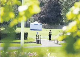  ??  ?? Forensic investigat­ion A police forensic team was at Strathaven Park following the death