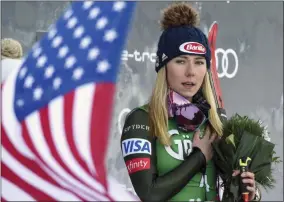  ?? PIERMARCO TACCA - THE ASSOCIATED PRESS ?? United States’ Mikaela Shiffrin, winner of an alpine ski, women’s World Cup giant slalom, listens to the national anthem, in Lienz, Austria, Saturday, Dec. 28, 2019.