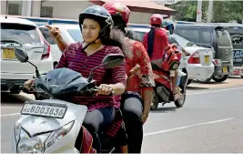  ??  ?? Women on bikes: Now a common sight in Polonnaruw­a. Pic by Karu Gamage