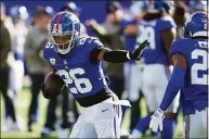  ?? Seth Wenig / Associated Press ?? Giants running back Saquon Barkley warms up before a game against the Texans in East Rutherford, N.J.