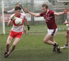  ??  ?? Danny Gardiner of Castletown closing down Niall Hughes.