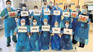  ??  ?? Intensive care medics at the Royal Glamorgan Hospital with their message to the public