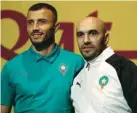  ?? ?? Morocco’s coach Walid Regragui (right) and defender Romain Ghanem Saiss arrive for a press conference at the Qatar National Convention Centre (QNCC) in Doha, yesterday.