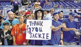  ?? MARK BROWN / ?? Fans at Marlins Park on Saturday night commemorat­e Jackie Robinson Day, the 70th anniversar­y of Robinson’s debut as the majors’ first AfricanAme­rican player on April 15, 1947 with the Brooklyn Dodgers.