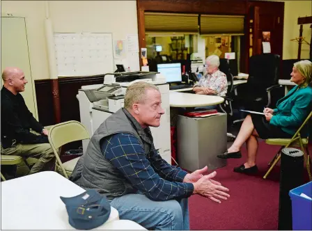  ?? SARAH GORDON/THE DAY ?? Norwich Mayor Peter Nystrom reacts to a question Tuesday as city officials listen in on a statewide conference call with Secretary of the State Denise Merrill regarding the upcoming primary election at the Register of Voters Office at Norwich City Hall.