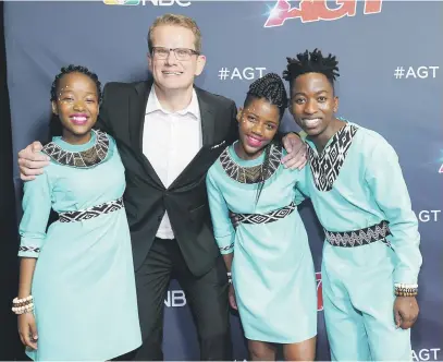  ?? Picture: AFP ?? HOT. Conductor Ralf Schmitt, second left, and the Ndlovu Youth Choir at the America’s Got Talent live show in Hollywood, California, earlier this month.