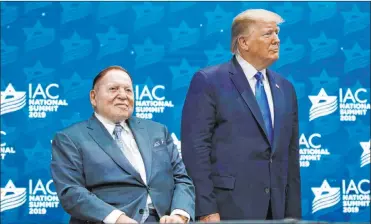  ?? Patrick Semansky The Associated Press file ?? President Donald Trump stands alongside Las Vegas Sands Corp. CEO Sheldon Adelson before speaking at the Israeli American Council National Summit in Hollywood, Fla., in 2019. Adelson, the billionair­e power broker who built a casino empire spanning from Las Vegas to China, died Monday after a long illness.