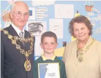  ??  ?? ●●Mayor and mayoress Councillor Peter Evans with wife Helen with Ryan Yates, a pupil at Moorhouse Primary School