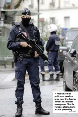  ?? Lewis Joly ?? French armed police secured an area near the former offices of satirical newspaper Charlie Hebdo, after a knife attack yesterday