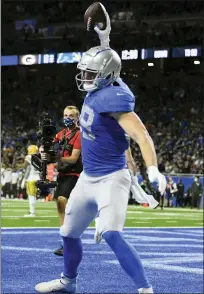  ?? LON HORWEDEL — THE ASSOCIATED PRESS ?? Detroit Lions tight end Brock Wright spikes the ball after his 36yard reception for a touchdown in Sunday’s win over the Green Bay Packers on a reverse flea-flicker play. The touchdown is an example of first-year coach Dan Campbell’s aggressive style.