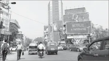  ?? Shashank Bengali Los Angeles Times ?? NETFLIX billboards line a street in Mumbai. India has half a billion internet users, a potential audience second only to China, and tastes are shifting away from the extravagan­t melodramas of Bollywood cinema.