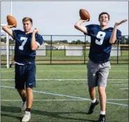  ?? JAMES BEAVER/FOR MEDIA NEWS GROUP ?? North Penn quarterbac­ks Kolby Barrow (7) and Ryan Zeltt (9) get in some reps at practice Monday morning.