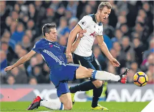  ??  ?? Cesar Azpilicuet­a of Chelsea and Harry Kane of Spurs compete for the ball.