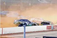  ?? Wade Payne / Associated Press ?? Drivers Corey LaJoie (7), Alex Bowman (48) and Noah Gragson wreck coming out turn 2 on Sunday.