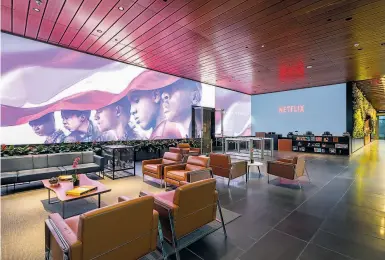  ?? Photos by Hunter Kerhart / New York Times ?? The showpiece of Netflix’s lobby is an 80by12foot video screen that makes viewers feel like part of a scene.