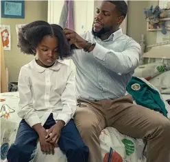  ?? Netflix ?? ■ Melody Hurd, left, and Kevin Hart are shown in a scene from "Fatherhood."