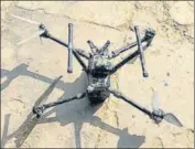  ?? ?? The drone that was shot down along the border at Kalia village in Tarn Taran and (right) the recovered heroin.