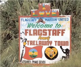  ??  ?? Sign welcoming visitors to the Maroon-ancestry community of Flagstaff.