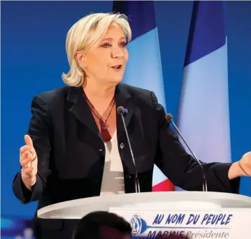  ?? (Charles Platiau/Reuters) ?? MARINE LE PEN delivers a speech Sunday after gaining a place in the second round of the French presidenti­al elections.