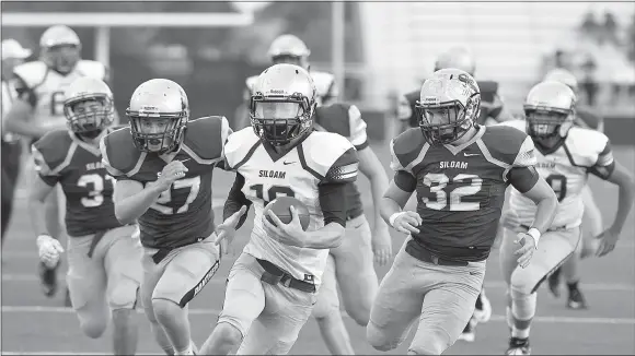  ?? Bud Sullins/Special to Siloam Sunday ?? Siloam Springs junior quarterbac­k Taylor Pool runs ahead of Maroon defenders Tanner Broyles and Kaiden Thrailkill on his way to a touchdown run in the spring game Tuesday at Panther Stadium.