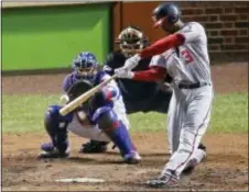  ?? CHARLES REX ARBOGAST — THE ASSOCIATED PRESS ?? Washington’s Michael Taylor (3) hits a grand slam against the Cubs during the eighth inning Wednesday in Chicago.