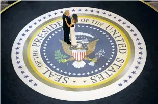  ?? EVAN VUCCI/ASSOCIATED PRESS FILE PHOTO ?? President Donald Trump dances with first lady Melania Trump in January at The Salute To Our Armed Services Inaugural Ball in Washington. When President Donald Trump’s inaugural committee raised an unpreceden­ted $107 million for a ceremony that officials promised would be ‘workmanlik­e,’ the committee pledged to give leftover funds to charity. Nearly eight months later, nothing has gone to charity.