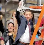  ?? Arkansas Democrat-Gazette/STEPHEN B. THORNTON ?? Coach Chris Beard celebrates with the fans after UALR picked up its 26th victory Saturday, more than any other team in NCAA Division I this season.