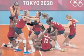  ?? FRANK AUGSTEIN — THE ASSOCIATED PRESS ?? United States players celebrate after defeating Brazil to win the volleyball gold medal.