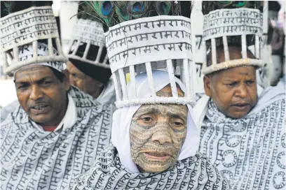  ?? ?? MEANINGFUL. Setbai, centre, is unfazed by the opening of a controvers­ial temple to Ram, even though she has his name tattooed all over her body. The tattoos were a message from the Dalits to the higher caste Hindus that the god they were being stopped from worshippin­g at a temple was for everyone, irrespecti­ve of caste.