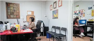  ?? DARRYL DYCK THE CANADIAN PRESS ?? Crisis line volunteers Shoak Alhussami, left, and Dyalla Popatia work at Battered Women's Support Services in Vancouver, where the severity of many callers’ situations have intensifie­d.